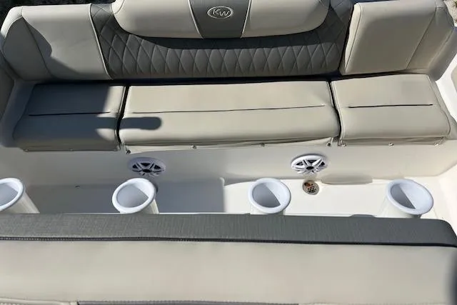 Slide: The Image of 2026 Key West 219 FS boat seating with cup holders and speakers. - 2