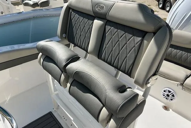 Slide: The Image of 2026 Key West 219 FS boat seating with cushioned backrest and armrests. - 5