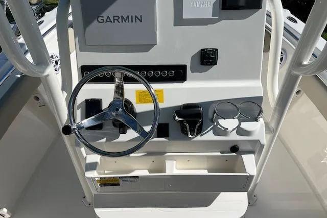 Slide: The Image of 2026 Key West 219 FS boat console with Garmin and Yamaha controls. - 6