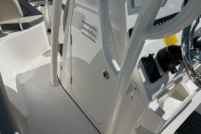 Slide: The Image of 2026 Key West 219 FS boat interior, featuring sleek white design and modern controls. - 8