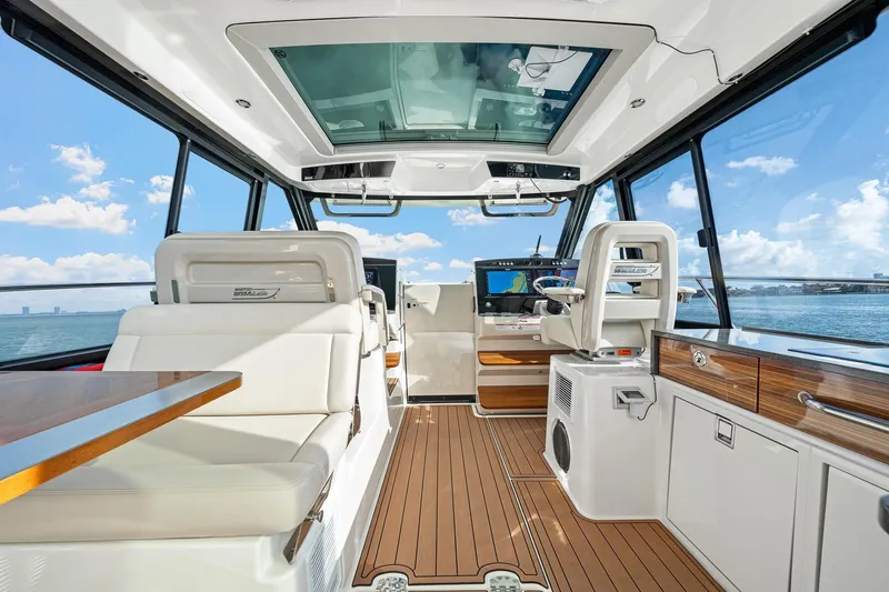 Slide: The Image of Luxurious interior of 2024 Boston Whaler 405 Conquest boat with modern navigation equipment. - 18