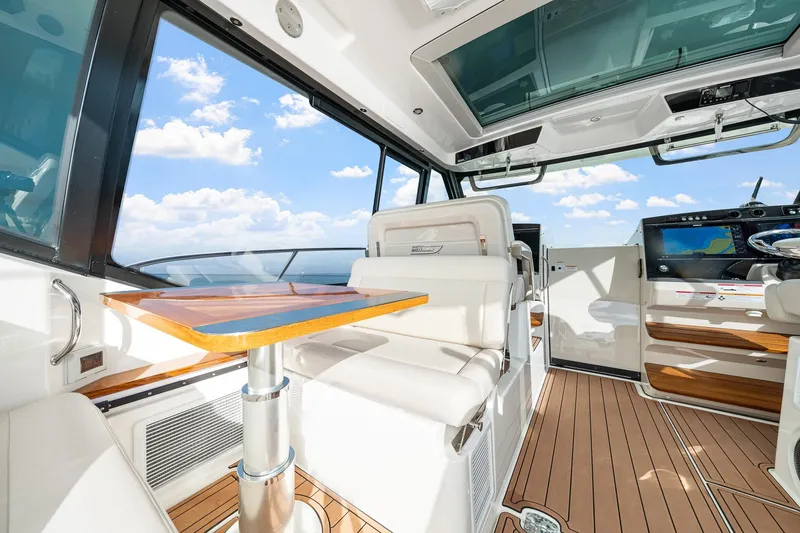 Slide: The Image of Luxurious interior of 2024 Boston Whaler 405 Conquest yacht with modern seating and navigation. - 20