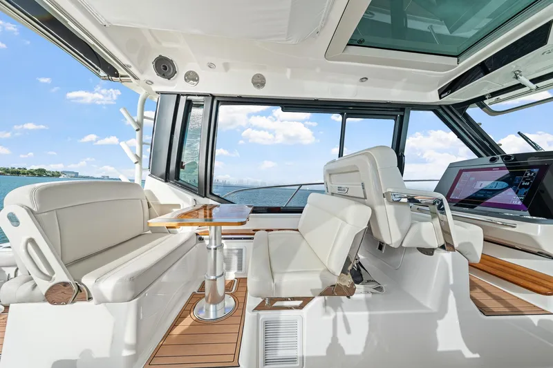 Slide: The Image of Luxurious interior of 2024 Boston Whaler 405 Conquest yacht with modern seating and navigation. - 23