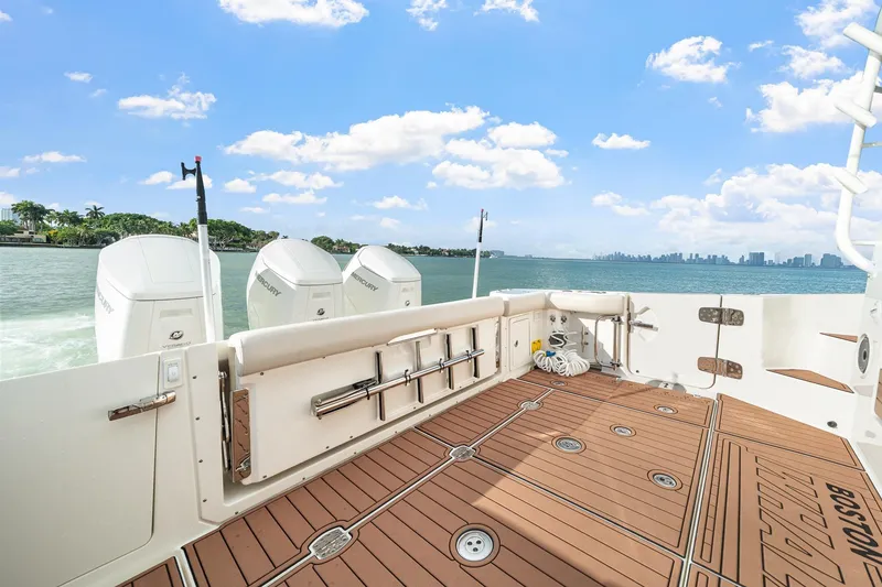 Slide: The Image of 2024 Boston Whaler 405 Conquest boat deck with scenic ocean view. - 37