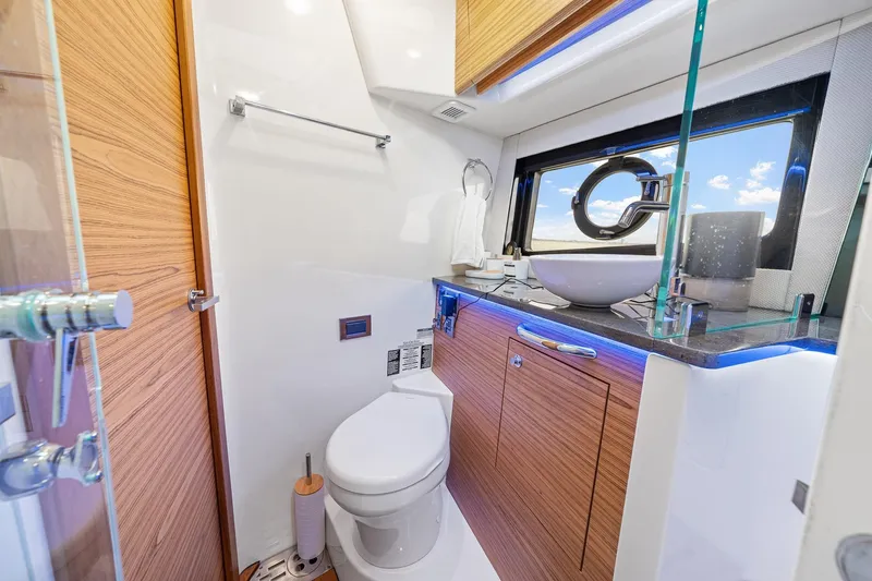 Slide: The Image of Luxurious bathroom in 2024 Boston Whaler 405 Conquest yacht with modern fixtures and ocean view. - 44