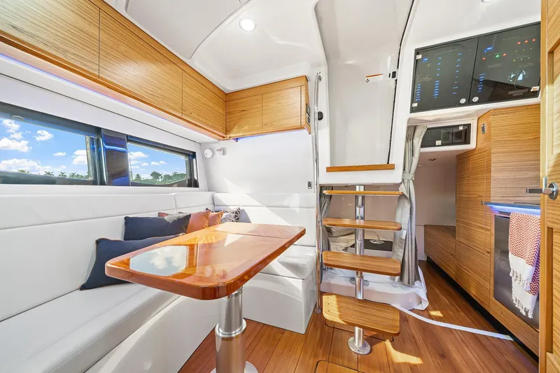 Slide: The Image of Luxurious interior of 2024 Boston Whaler 405 Conquest yacht with modern wood finishes. - 47