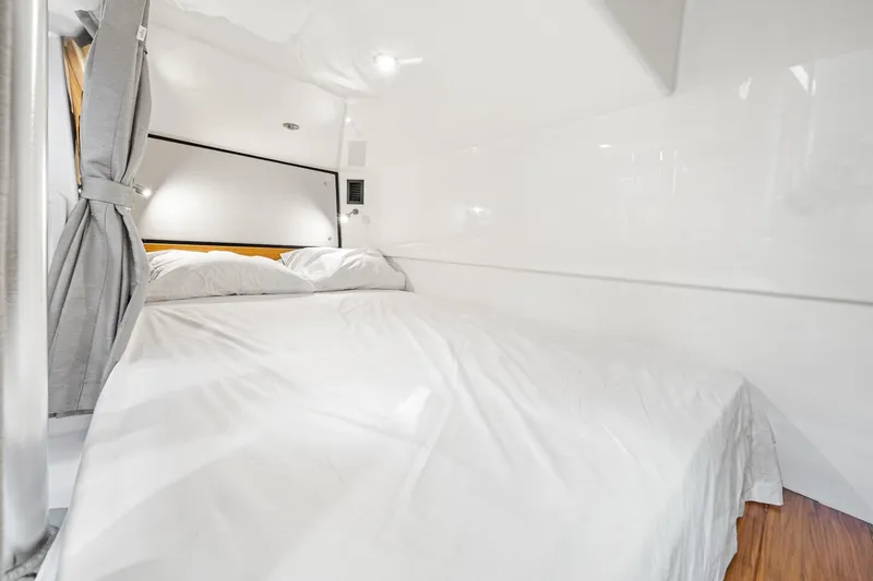 Slide: The Image of Luxurious cabin interior of 2024 Boston Whaler 405 Conquest with cozy bedding. - 51