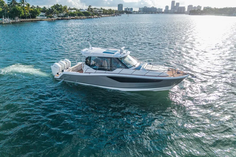 Slide: The Image of 2024 Boston Whaler 405 Conquest cruising on a sunny day in coastal waters. - 59