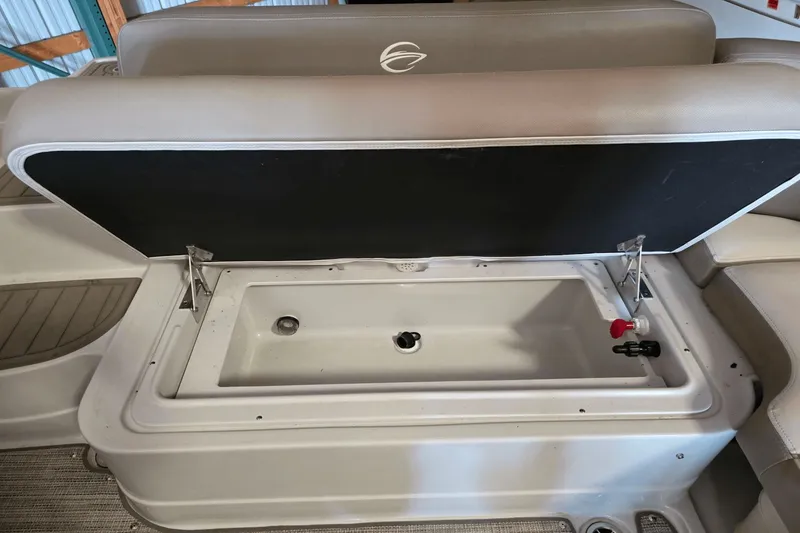 Slide: The Image of Open storage compartment in 2021 Crownline E 205 XS boat. - 17