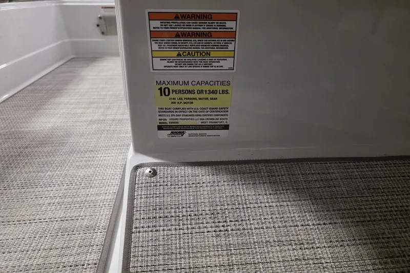 Slide: The Image of 2021 Crownline E 205 XS boat capacity warning label, maximum 10 persons or 1,340 lbs. - 18