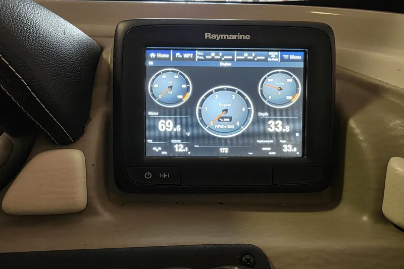 Slide: The Image of Raymarine display on 2021 Crownline E 205 XS boat dashboard showing engine metrics. - 20