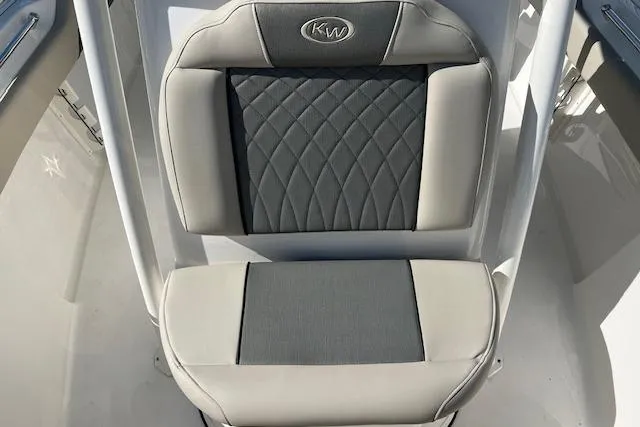 Slide: The Image of 2026 Key West 219 FS boat seat with quilted design and KW logo. - 11