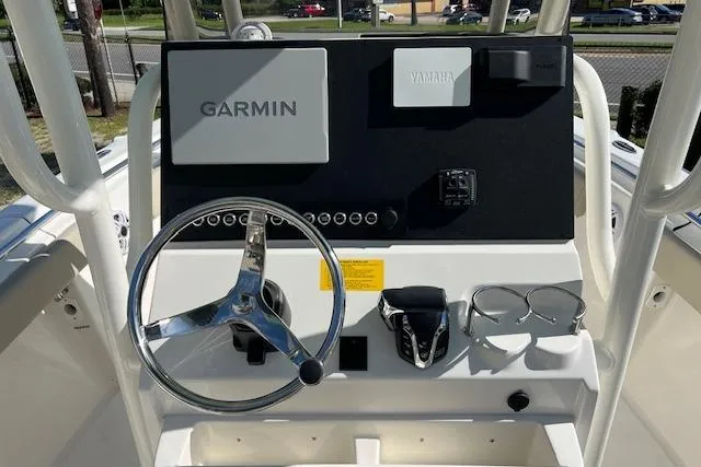 Slide: The Image of 2026 Key West 219 FS boat dashboard with Garmin and Yamaha controls. - 6