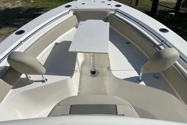 Slide: The Image of 2026 Key West 219 FS boat interior with seating and table setup. - 9