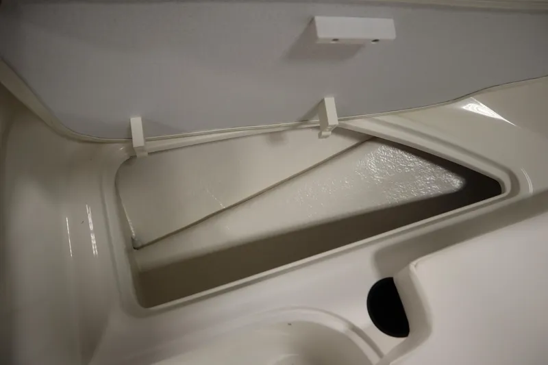 Slide: The Image of Open storage compartment in 2026 Bayliner Element E18 boat. - 13