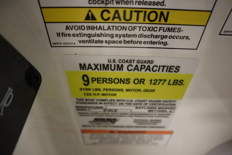 Slide: The Image of 2026 Bayliner Element E18 capacity label, 9 persons or 1277 lbs, 125 HP motor. - 19