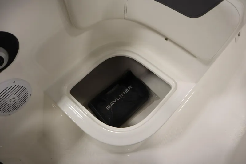 Slide: The Image of 2026 Bayliner Element E18 boat storage compartment with Bayliner bag inside. - 21