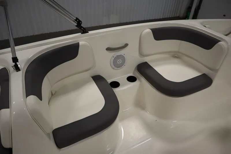 Slide: The Image of 2026 Bayliner Element E18 boat interior with cushioned seating and cup holders. - 22