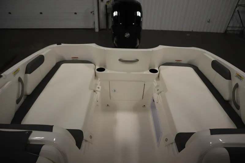 Slide: The Image of 2026 Bayliner Element E18 boat interior with seating and storage compartments. - 24