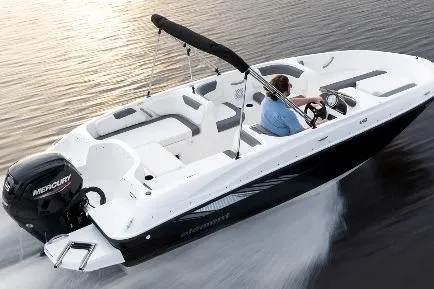 Slide: The Image of 2026 Bayliner Element E18 boat in a showroom, side view with trailer. - 3
