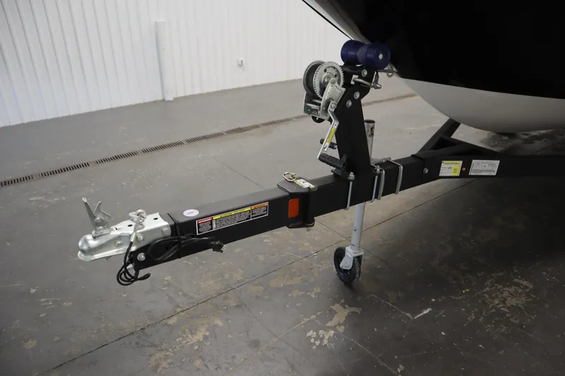 Slide: The Image of Trailer hitch of 2026 Bayliner Element E18 boat in a garage setting. - 33