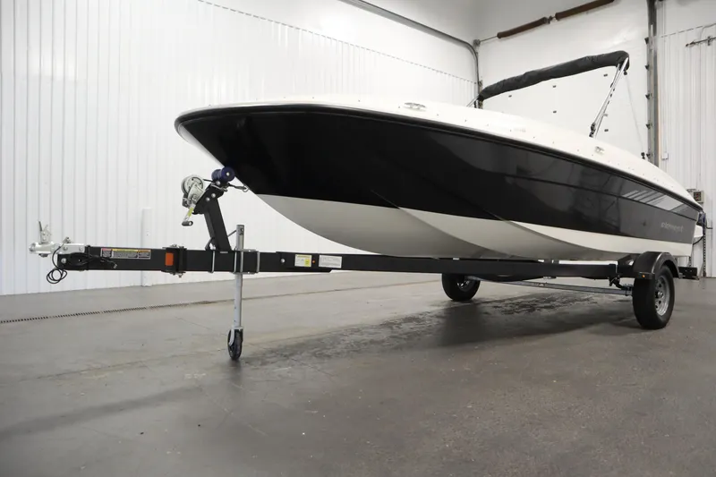 Slide: The Image of 2026 Bayliner Element E18 boat on trailer in indoor setting. - 34