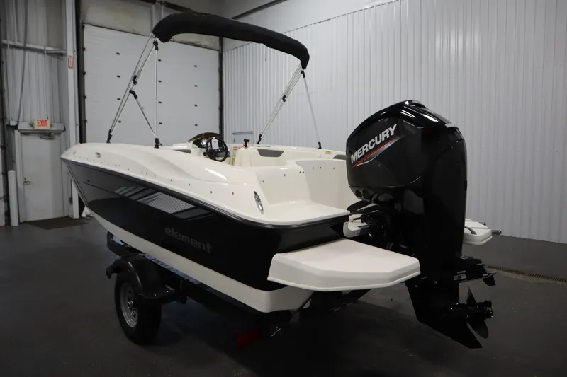 Slide: The Image of 2026 Bayliner Element E18 boat with Mercury engine in indoor storage. - 6