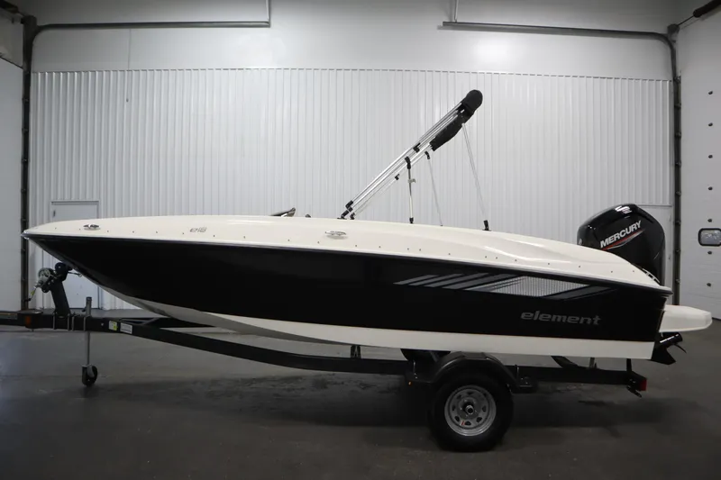 Slide: The Image of 2026 Bayliner Element E18 boat with Mercury engine in a garage setting. - 7