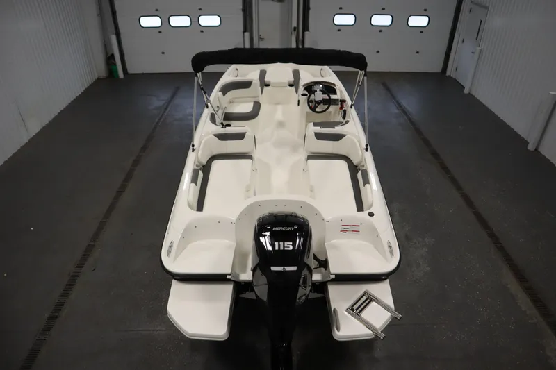Slide: The Image of 2026 Bayliner Element E18 boat in a garage, featuring a Mercury 115 engine. - 9