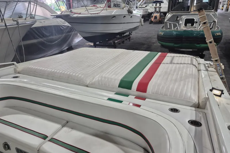 Slide: The Image of 1982 Magnum 40 boat with Italian flag colors, stored indoors. - 20