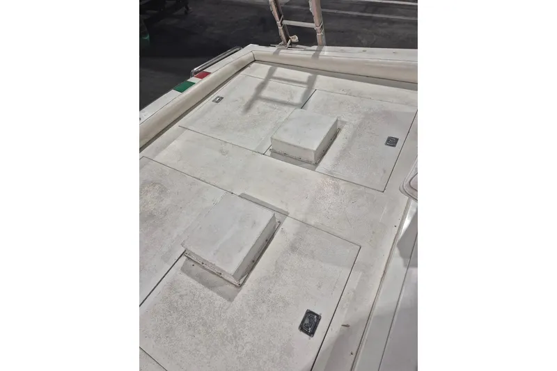 Slide: The Image of 1982 Magnum 40 boat deck with storage hatches and ladder. - 22