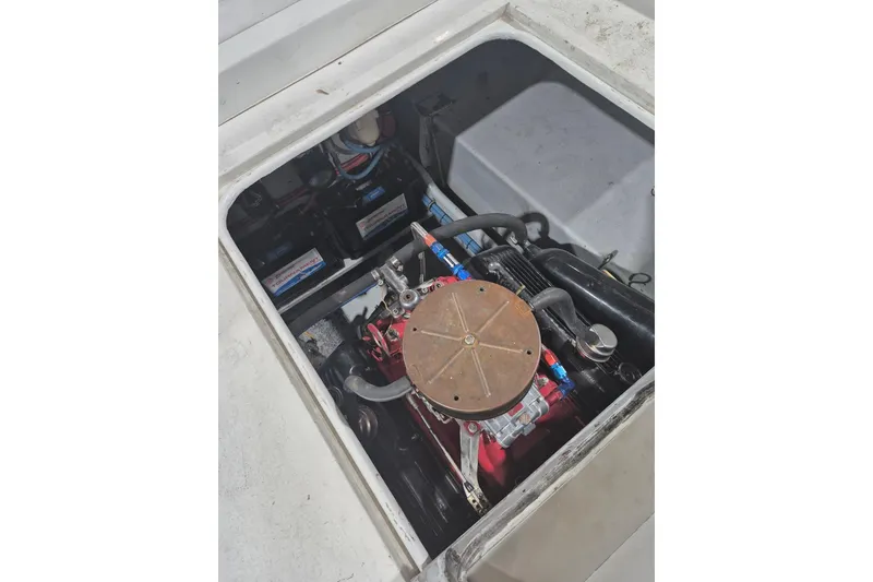 Slide: The Image of Engine compartment of a 1982 Magnum 40 boat, showcasing mechanical components. - 24
