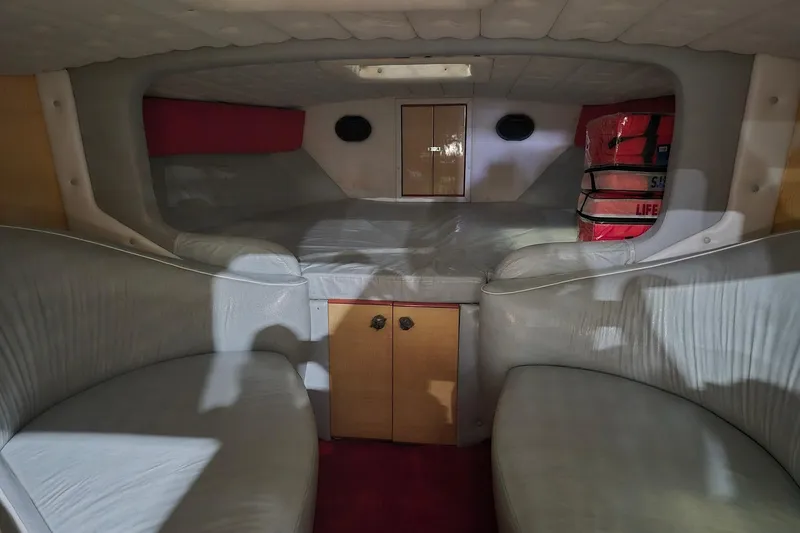 Slide: The Image of Interior of a 1982 Magnum 40 boat with seating and life jackets. - 28