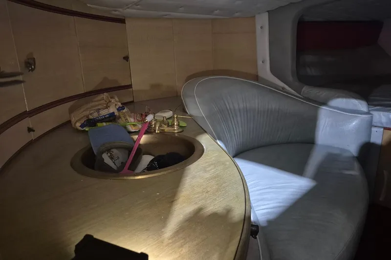 Slide: The Image of Interior of a 1982 Magnum 40 boat with seating and storage area. - 30