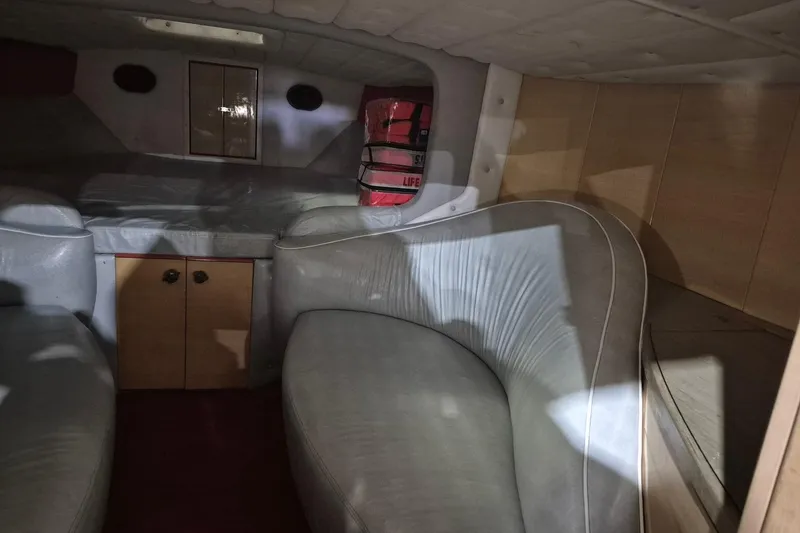 Slide: The Image of Interior of a 1982 Magnum 40 boat with seating and storage. - 31