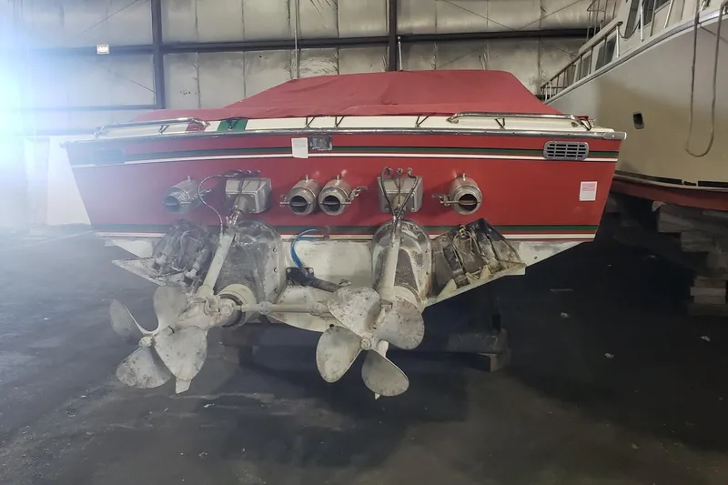 Slide: The Image of 1982 Magnum 40 boat with dual propellers in a storage facility. - 7