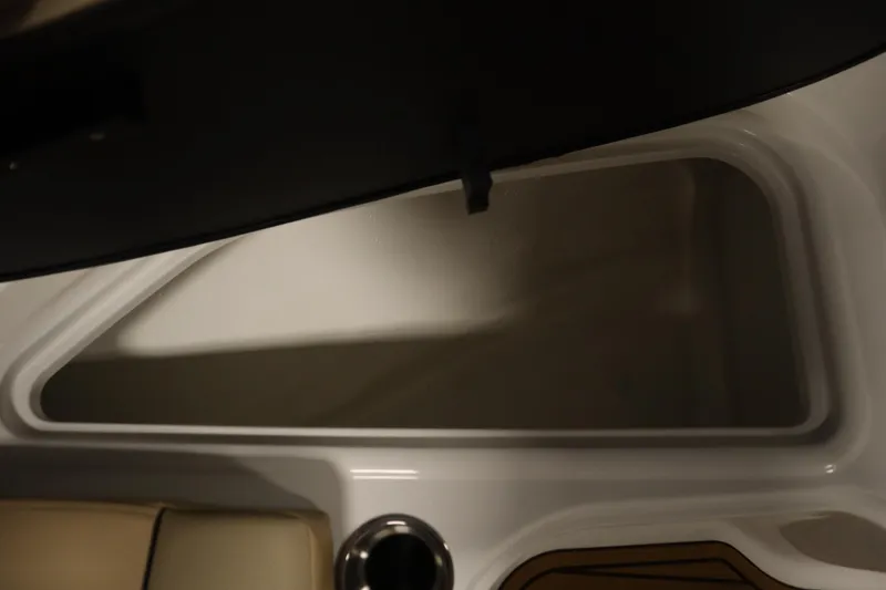 Slide: The Image of 2025 Bayliner VR6 Bowrider OB interior detail with seating and storage compartment. - 15