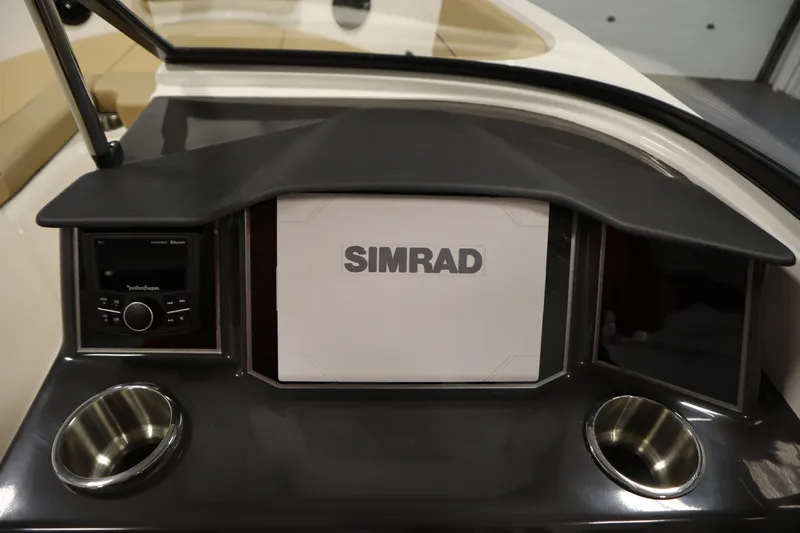 Slide: The Image of Dashboard of 2025 Bayliner VR6 Bowrider OB with Simrad display and cup holders. - 19