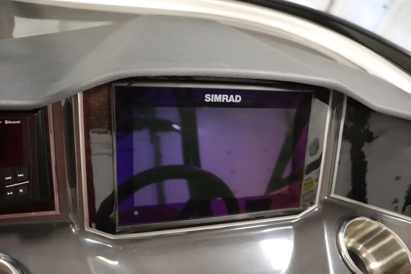 Slide: The Image of Simrad display on 2025 Bayliner VR6 Bowrider OB dashboard, featuring modern navigation technology. - 21