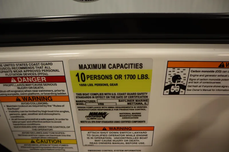 Slide: The Image of 2025 Bayliner VR6 Bowrider OB capacity label: 10 persons or 1700 lbs maximum. - 25