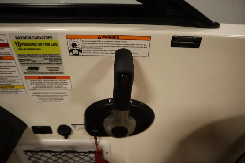 Slide: The Image of Control panel of 2025 Bayliner VR6 Bowrider OB with capacity and safety warnings. - 26