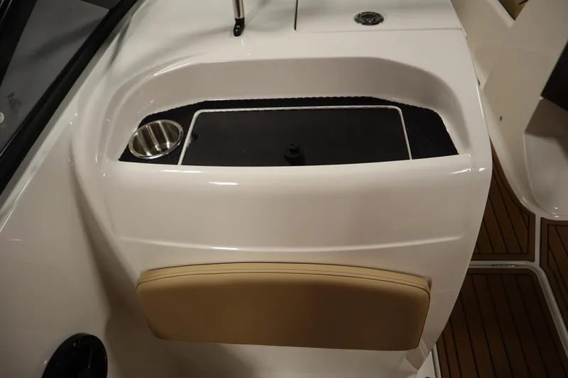 Slide: The Image of 2025 Bayliner VR6 Bowrider OB interior detail with cup holder and storage compartment. - 31