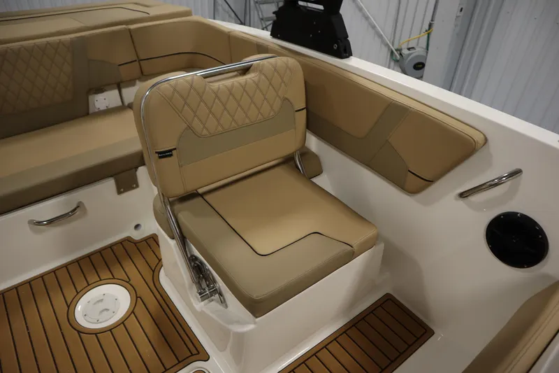 Slide: The Image of 2025 Bayliner VR6 Bowrider OB interior with tan seating and teak-style flooring. - 36