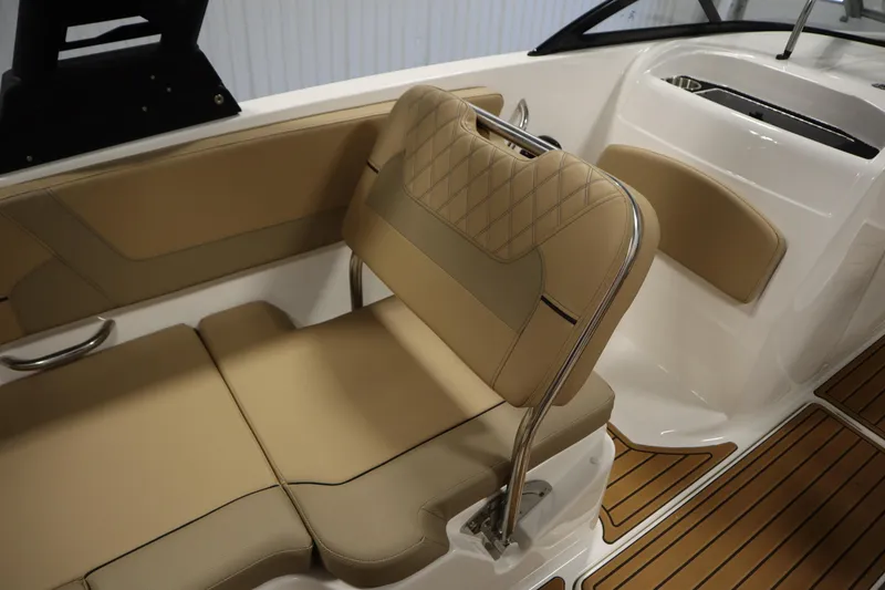 Slide: The Image of 2025 Bayliner VR6 Bowrider OB interior with tan seating and sleek design. - 37