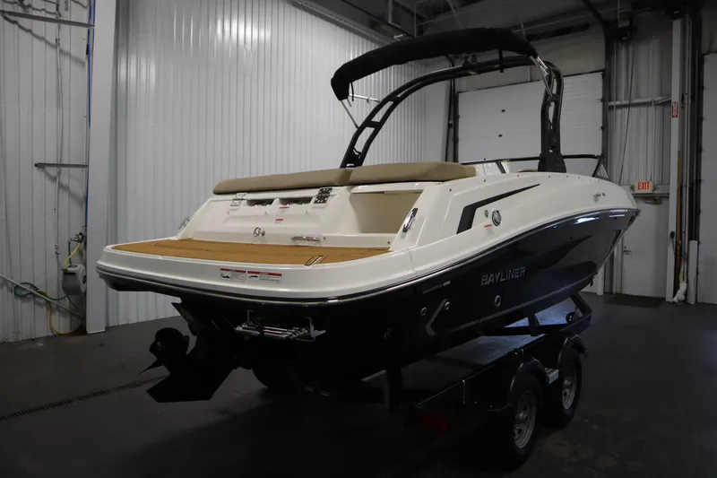 Slide: The Image of 2025 Bayliner VR6 Bowrider OB in a garage, showcasing sleek design and modern features. - 4