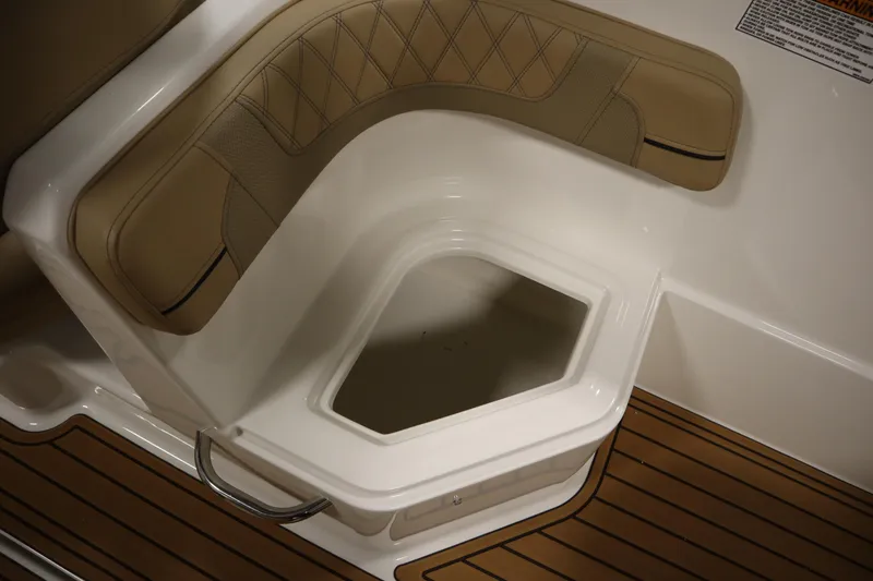 Slide: The Image of 2025 Bayliner VR6 Bowrider OB seating area with storage compartment and teak flooring. - 43