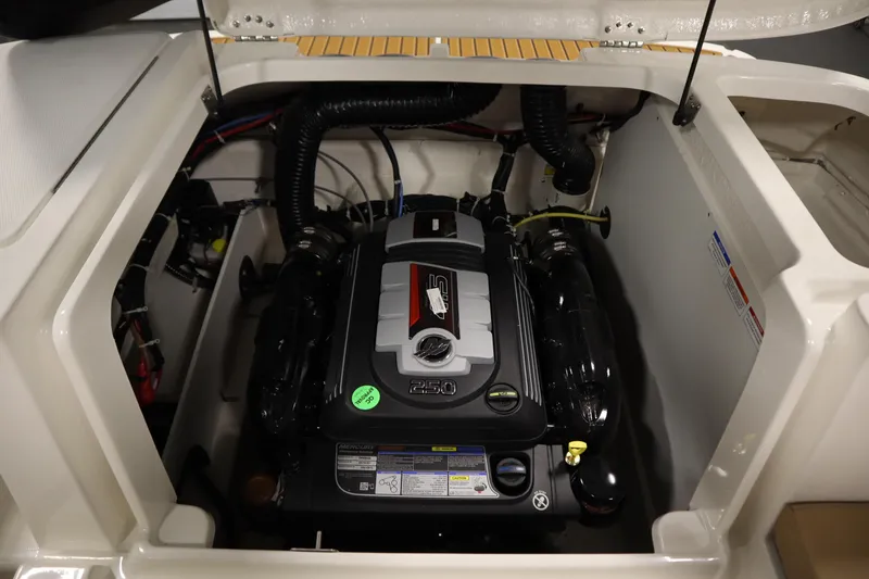 Slide: The Image of 2025 Bayliner VR6 Bowrider OB engine compartment, showcasing a powerful Mercury engine. - 46