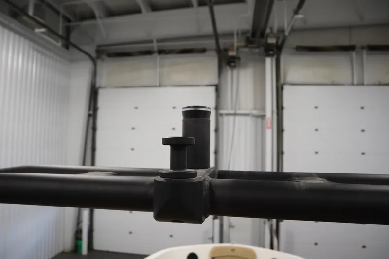 Slide: The Image of 2025 Bayliner VR6 Bowrider OB detail in a garage setting. - 48