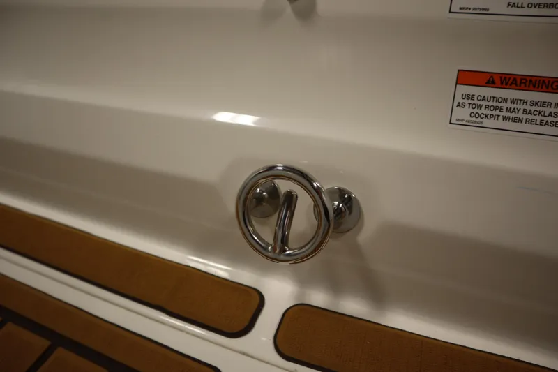 Slide: The Image of 2025 Bayliner VR6 Bowrider OB boat detail with chrome handle and warning label. - 49