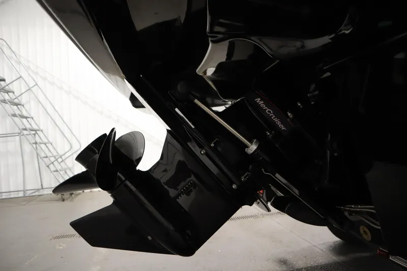 Slide: The Image of 2025 Bayliner VR6 Bowrider OB with MerCruiser engine detail in a garage setting. - 53